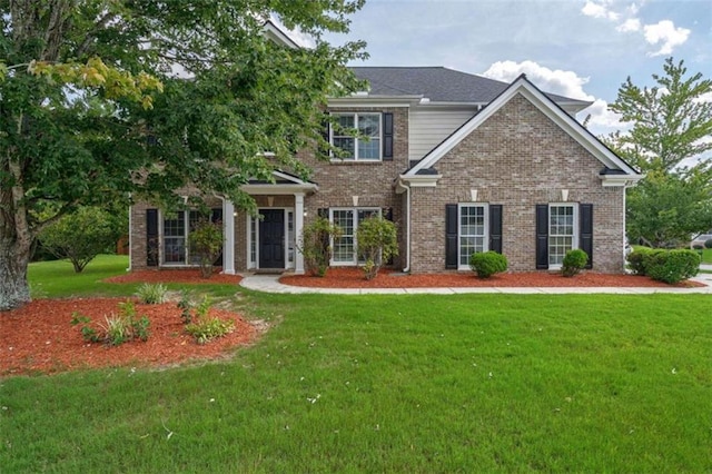 craftsman-style home with a front yard