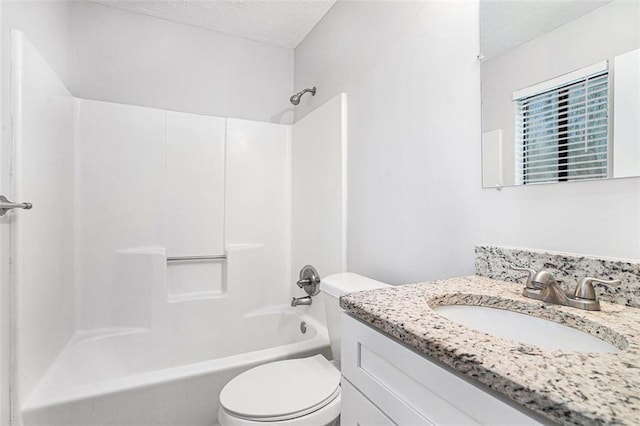 full bathroom with a textured ceiling, vanity, toilet, and shower / bathtub combination