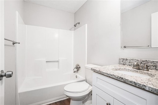 full bathroom featuring shower / bathing tub combination, hardwood / wood-style flooring, vanity, and toilet