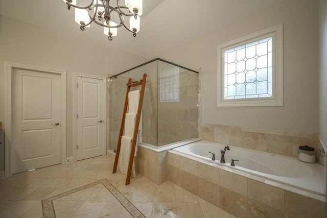 full bathroom featuring a chandelier, a shower stall, and a garden tub