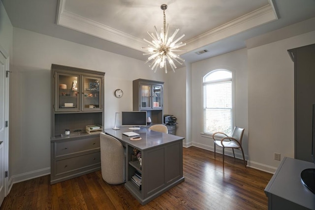 office space featuring a chandelier, visible vents, dark wood finished floors, and a tray ceiling