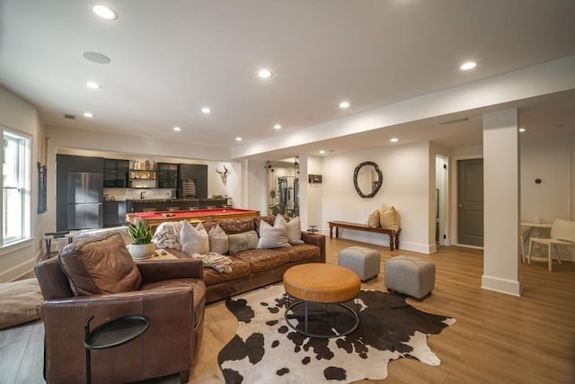 living room with pool table, recessed lighting, baseboards, and light wood finished floors