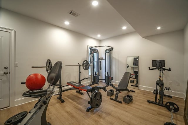 workout room featuring recessed lighting, wood finished floors, visible vents, and baseboards