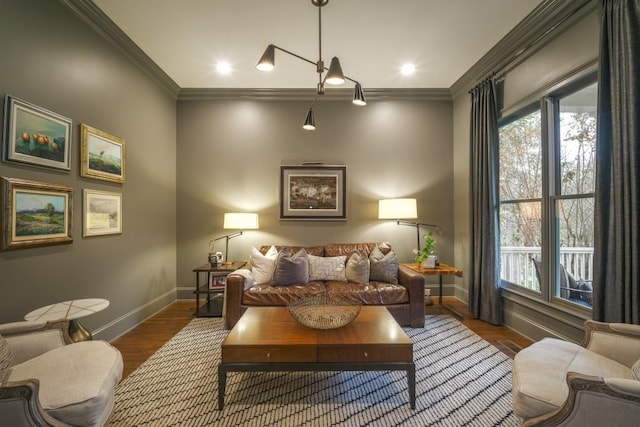 living room featuring plenty of natural light, baseboards, and ornamental molding