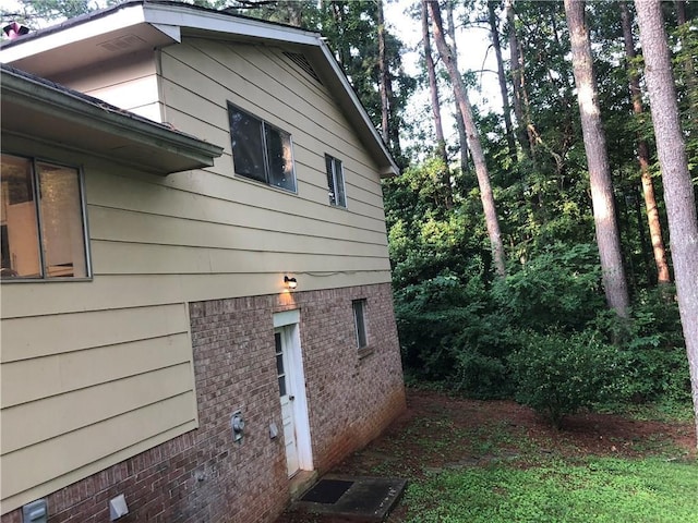 view of side of property with brick siding