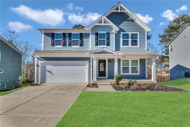 view of front of house with a garage and a front lawn