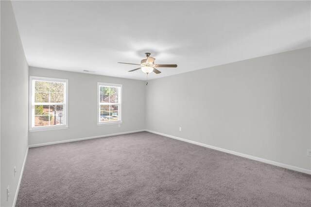 unfurnished room featuring carpet flooring and ceiling fan