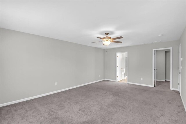 unfurnished room featuring ceiling fan and light colored carpet