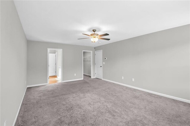 interior space with ceiling fan