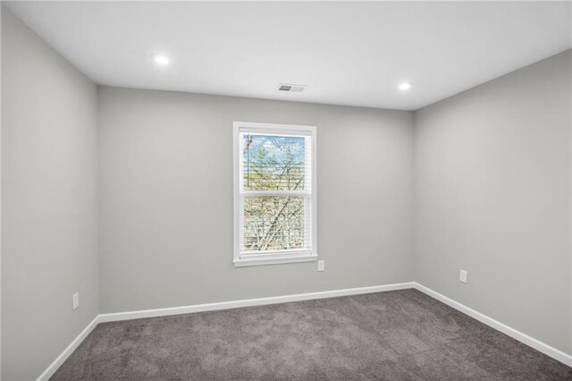 empty room with carpet flooring