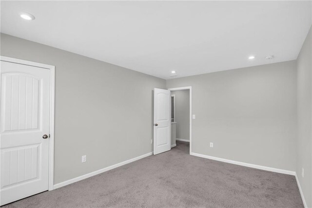 unfurnished bedroom with light carpet