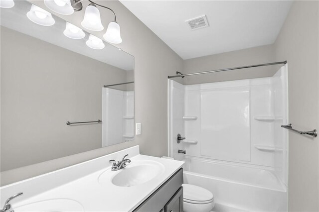 full bathroom featuring vanity, toilet, and washtub / shower combination