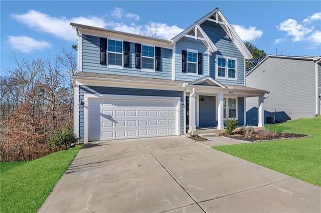 view of front of home featuring a front lawn and a garage