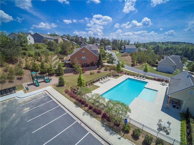 view of pool featuring a playground