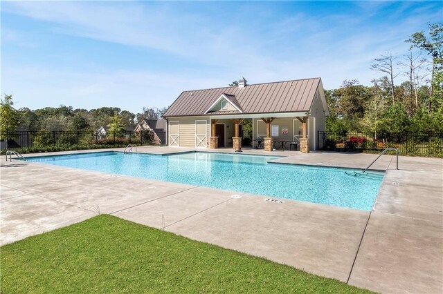 view of pool featuring a patio