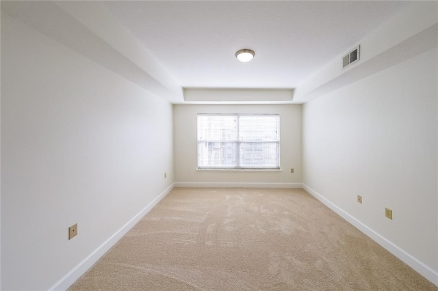 unfurnished room with light carpet