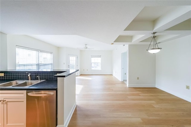 kitchen featuring sink, hanging light fixtures, light wood-type flooring, dishwasher, and ceiling fan