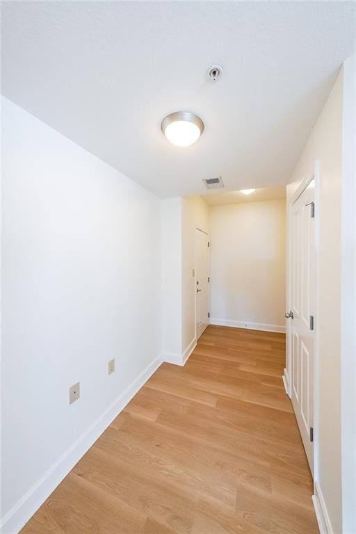 corridor featuring light hardwood / wood-style flooring