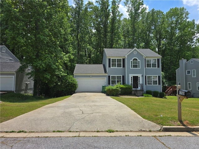 5769 Shadow Creek Dr, Lithonia, GA 30058 - colonial-style house featuring a garage, driveway, and a front yard