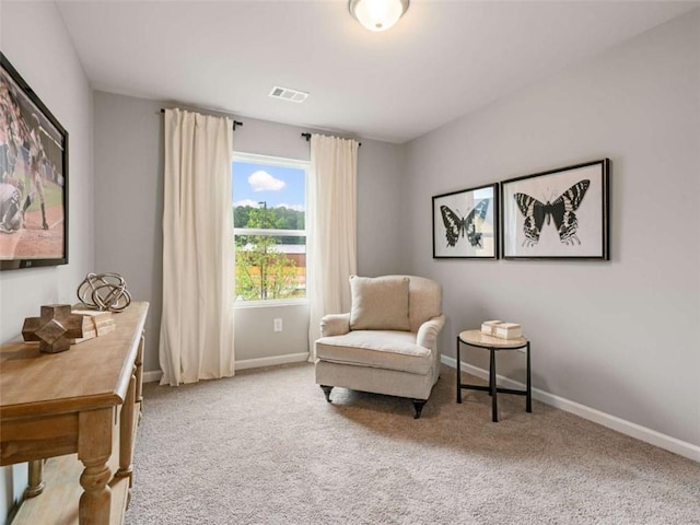 sitting room with light colored carpet