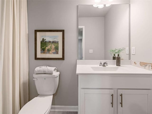 bathroom featuring vanity and toilet