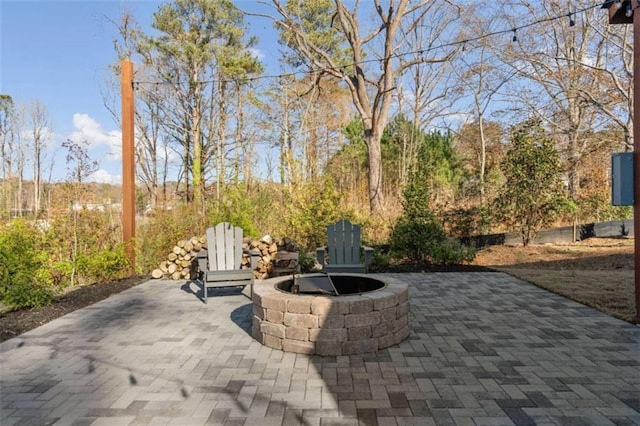 view of patio featuring an outdoor fire pit