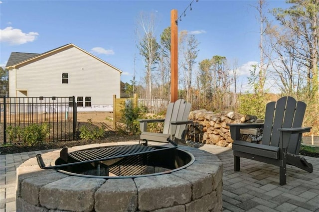 view of patio / terrace featuring a fire pit