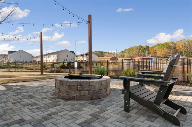 view of patio / terrace featuring an outdoor fire pit