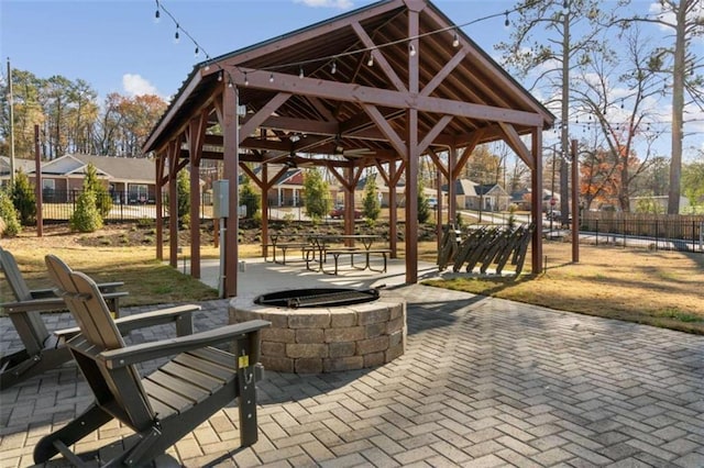 view of home's community featuring a gazebo, a patio, and a fire pit