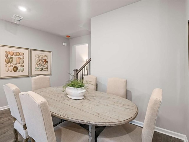 dining area featuring dark hardwood / wood-style floors