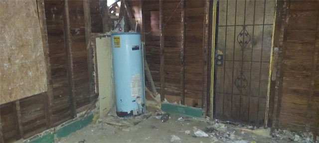 utility room with water heater