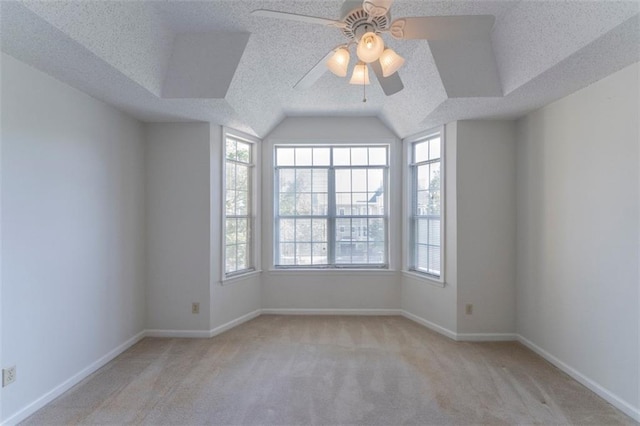 1015 Mcgill Park Ave NE, Atlanta, GA 30312 - carpeted spare room with ceiling fan, vaulted ceiling, baseboards, and a textured ceiling