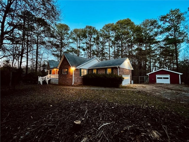 property exterior at dusk featuring an outdoor structure