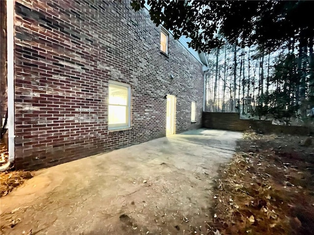 view of home's exterior featuring brick siding