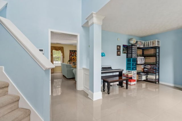 570 White Stag Ct, Suwanee, GA 30024 - foyer with stairs, decorative columns, and light tile patterned floors