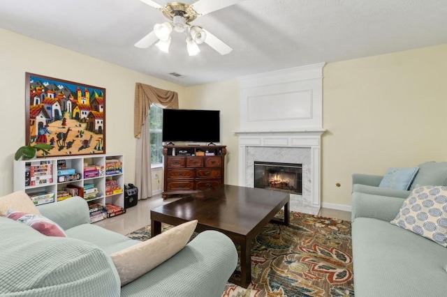 570 White Stag Ct, Suwanee, GA 30024 - living area with a ceiling fan, a high end fireplace, and baseboards