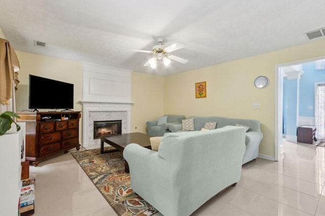 570 White Stag Ct, Suwanee, GA 30024 - living area featuring a ceiling fan, light tile patterned floors, a premium fireplace, and baseboards