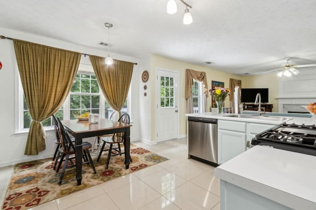 570 White Stag Ct, Suwanee, GA 30024 - kitchen featuring dishwasher, light countertops, ceiling fan, light tile patterned floors, and range