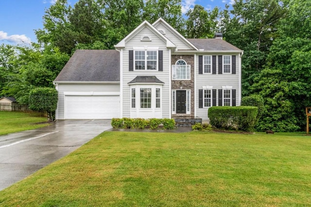 570 White Stag Ct, Suwanee, GA 30024 - view of front of house with a garage, driveway, and a chimney