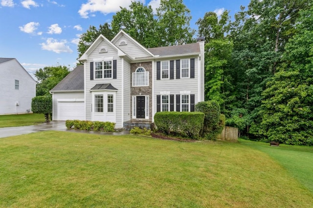 570 White Stag Ct, Suwanee, GA 30024 - view of front of home featuring a chimney, driveway, and a front lawn