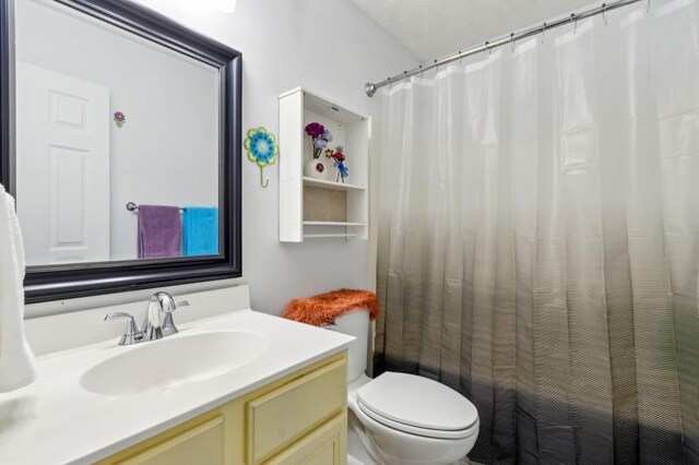 570 White Stag Ct, Suwanee, GA 30024 - bathroom featuring toilet, vanity, and curtained shower