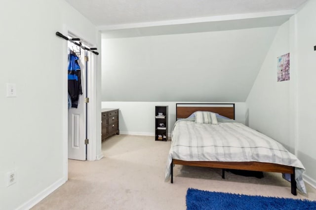 570 White Stag Ct, Suwanee, GA 30024 - carpeted bedroom with baseboards and lofted ceiling