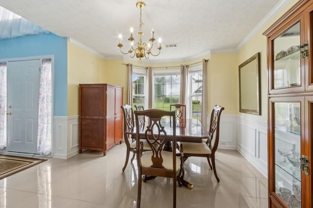 570 White Stag Ct, Suwanee, GA 30024 - dining space featuring a chandelier, a decorative wall, a wainscoted wall, a textured ceiling, and light tile patterned flooring