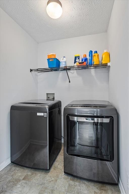 2711 Bluffton Rd, Buford, GA 30519 - laundry area featuring washing machine and dryer and a textured ceiling