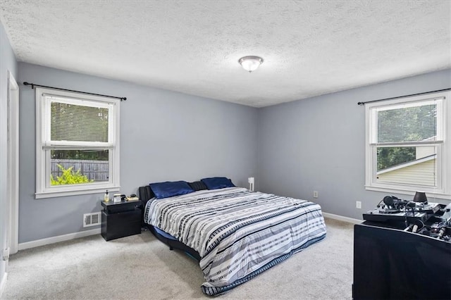 2711 Bluffton Rd, Buford, GA 30519 - carpeted bedroom with baseboards and a textured ceiling