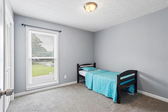 2711 Bluffton Rd, Buford, GA 30519 - bedroom with carpet flooring and a textured ceiling