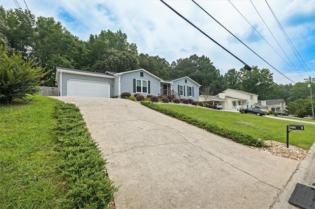 2711 Bluffton Rd, Buford, GA 30519 - ranch-style home with concrete driveway, an attached garage, and view of wooded area