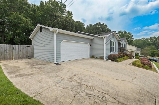 2711 Bluffton Rd, Buford, GA 30519 - view of home's exterior with a garage and driveway