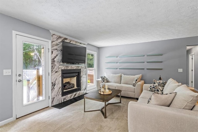 2711 Bluffton Rd, Buford, GA 30519 - living room with a textured ceiling, a premium fireplace, and carpet flooring