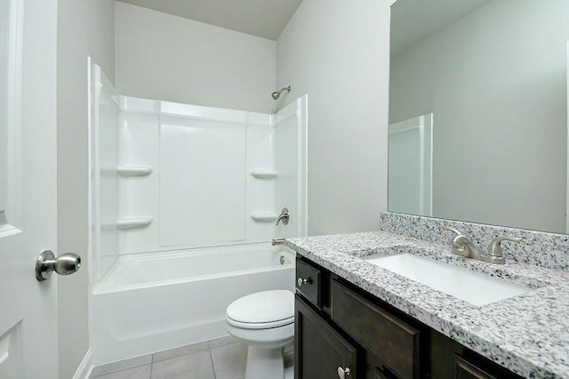 full bath with tile patterned flooring, toilet, vanity, and shower / tub combination